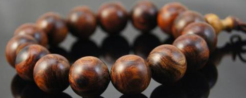 新黃花梨手串盤幾天為什么很干